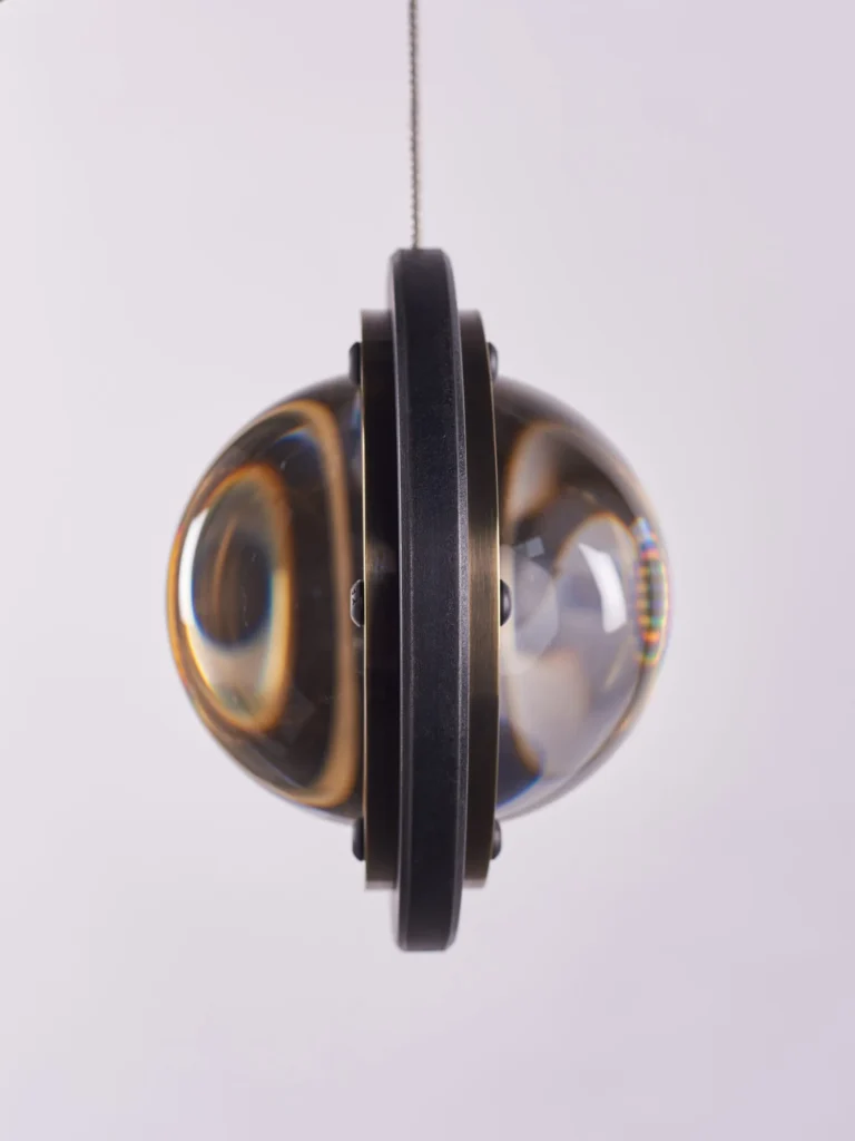 Da Vinci Infinity 1519 pendant light by Karice. Inspired by Leonardo da Vinci, symbolizing a setting sun, as 1519 is the year he passed away. Made out of antiqued genuine brass to reflect the old-age era.