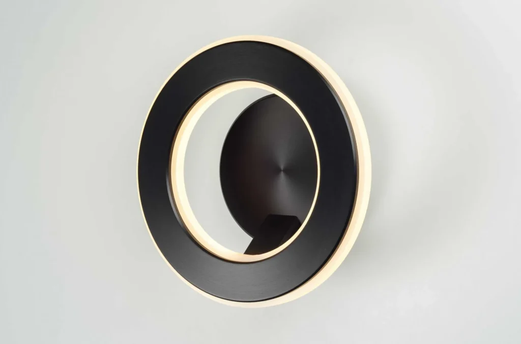 Electron wall sconce with circular illuminated ring, concealed fasteners, and inner and outer LED lighting. Designed and manufactured by Karice.