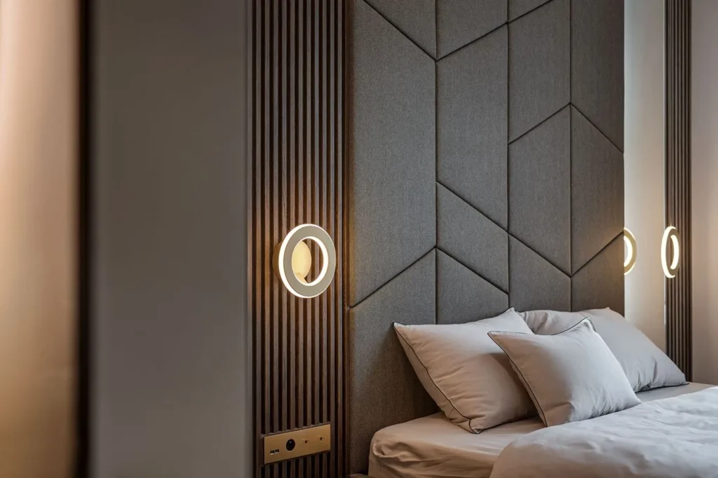 Electron wall sconce with circular illuminated ring, concealed fasteners, and inner and outer LED lighting. Designed and manufactured by Karice.