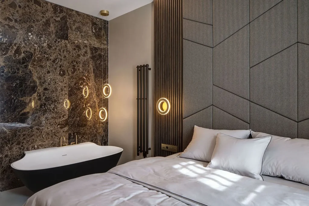 Electron wall sconce with circular illuminated ring, concealed fasteners, and inner and outer LED lighting. Designed and manufactured by Karice.