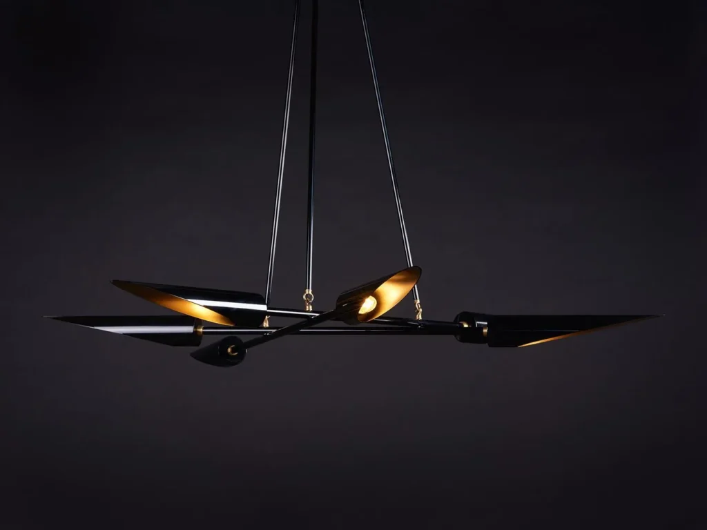 Harmony mid-century chandelier with six lamps, brass accents, and a gloss black finish. Manufactured by Karice.