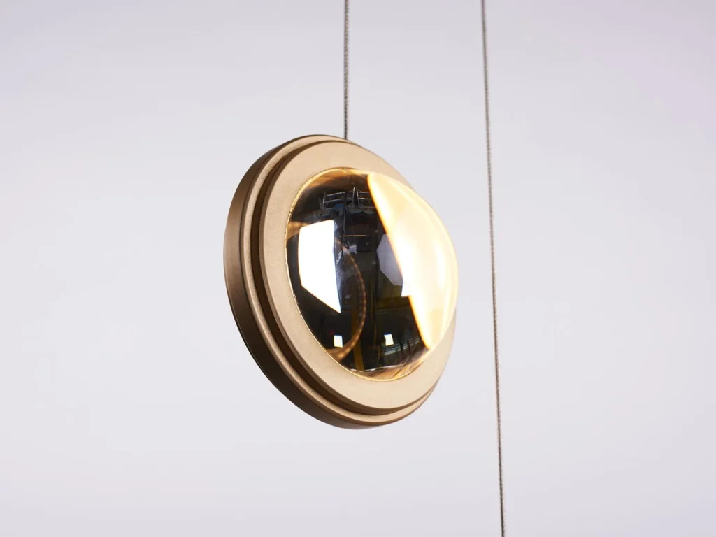 Infinity modern pendant with rotating glass orbs. Designed and manufactured by Karice.