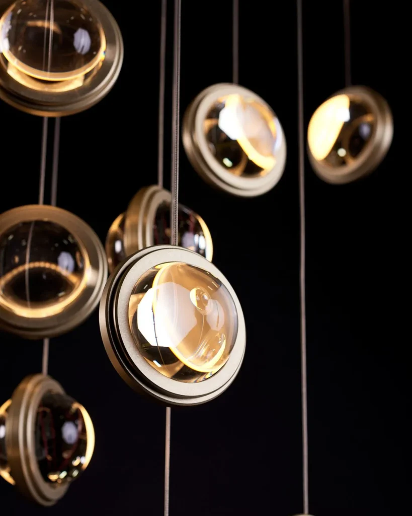 Infinity modern pendant with rotating glass orbs. Designed and manufactured by Karice.