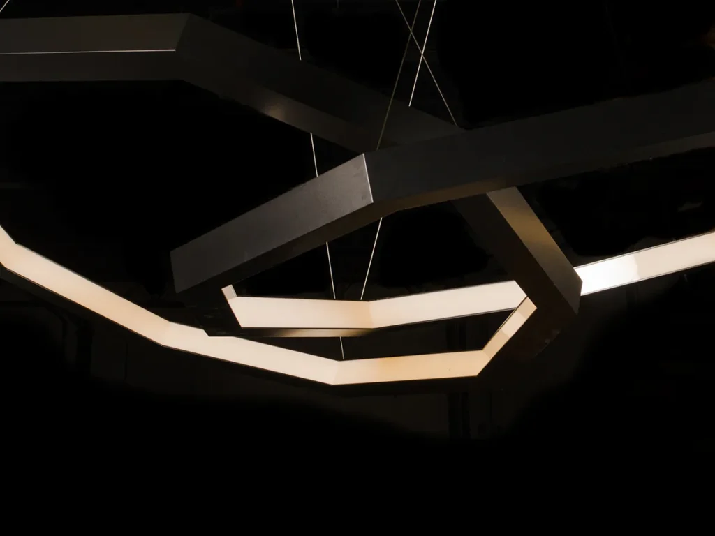 Linked Luxennea geometric LED chandelier with a nine-sided form. Designed and manufactured by Karice.