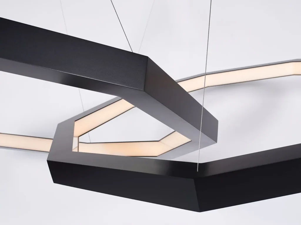 Linked Luxennea geometric LED chandelier with a nine-sided form. Designed and manufactured by Karice.