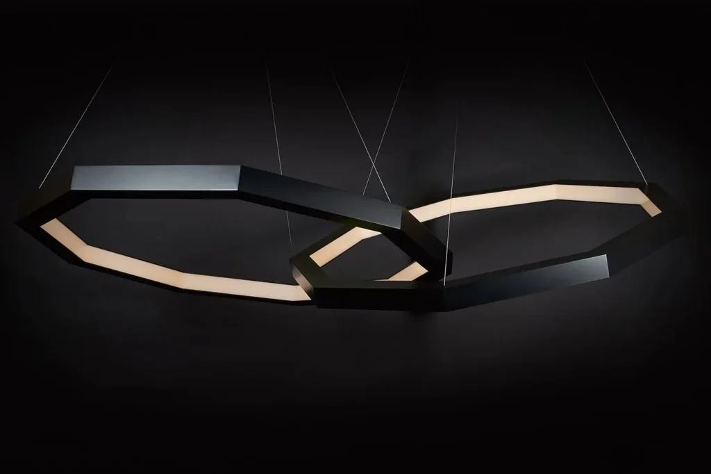 Linked Luxennea geometric LED chandelier with a nine-sided form. Designed and manufactured by Karice.
