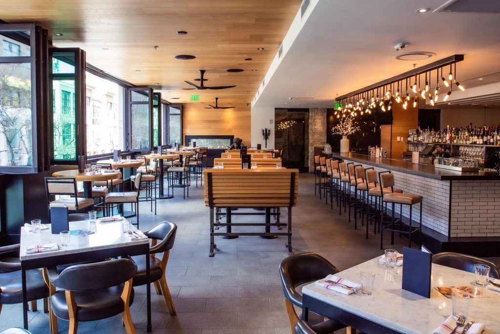 Custom swivel pendant lighting fixture for Earls Kitchen & Bar in Glenarm, Denver, CO, USA. Manufactured and designed by Karice.