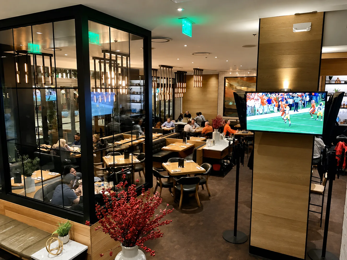 Custom inverted vertical tube pendant lighting for Earls Kitchen & Bar in Glenarm, Denver, CO, USA. Manufactured and designed by Karice.
