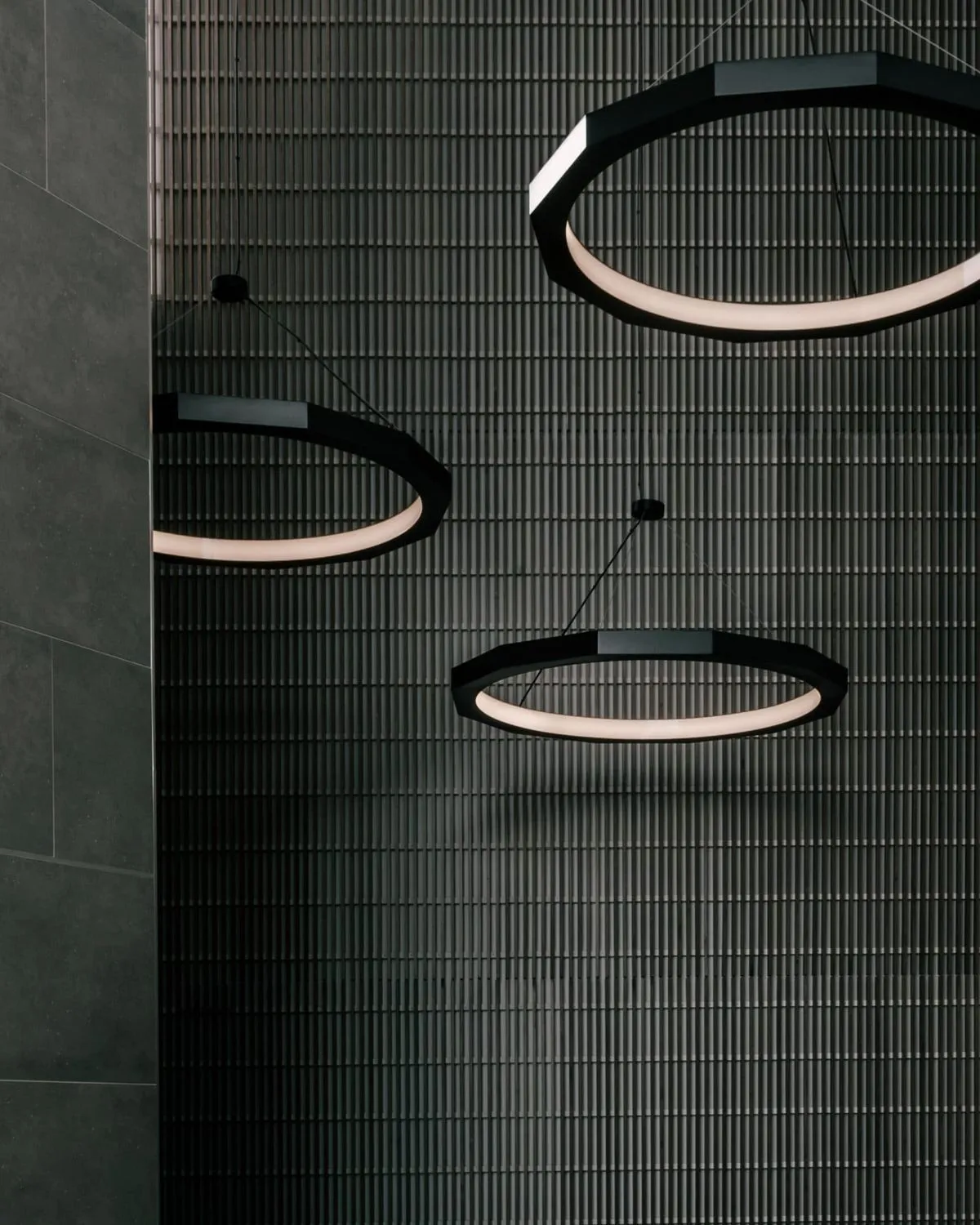 Faceted ring pendant lighting for Cactus Club Cafe. Manufactured by Karice.