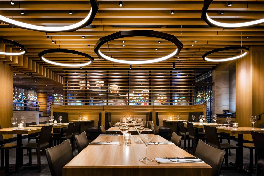 Faceted ring pendant lighting for Cactus Club Cafe. Manufactured by Karice.