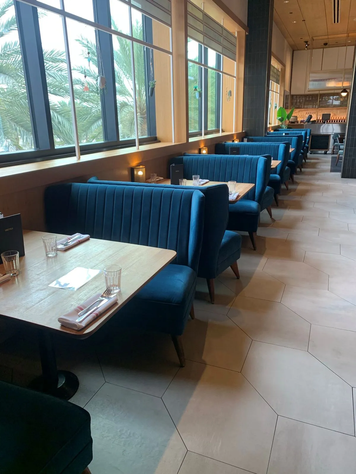 Custom brushed gold wall sconces for Earls Kitchen & Bar in The Mall at Millenia, Orlando, FL, USA. Manufactured by Karice.
