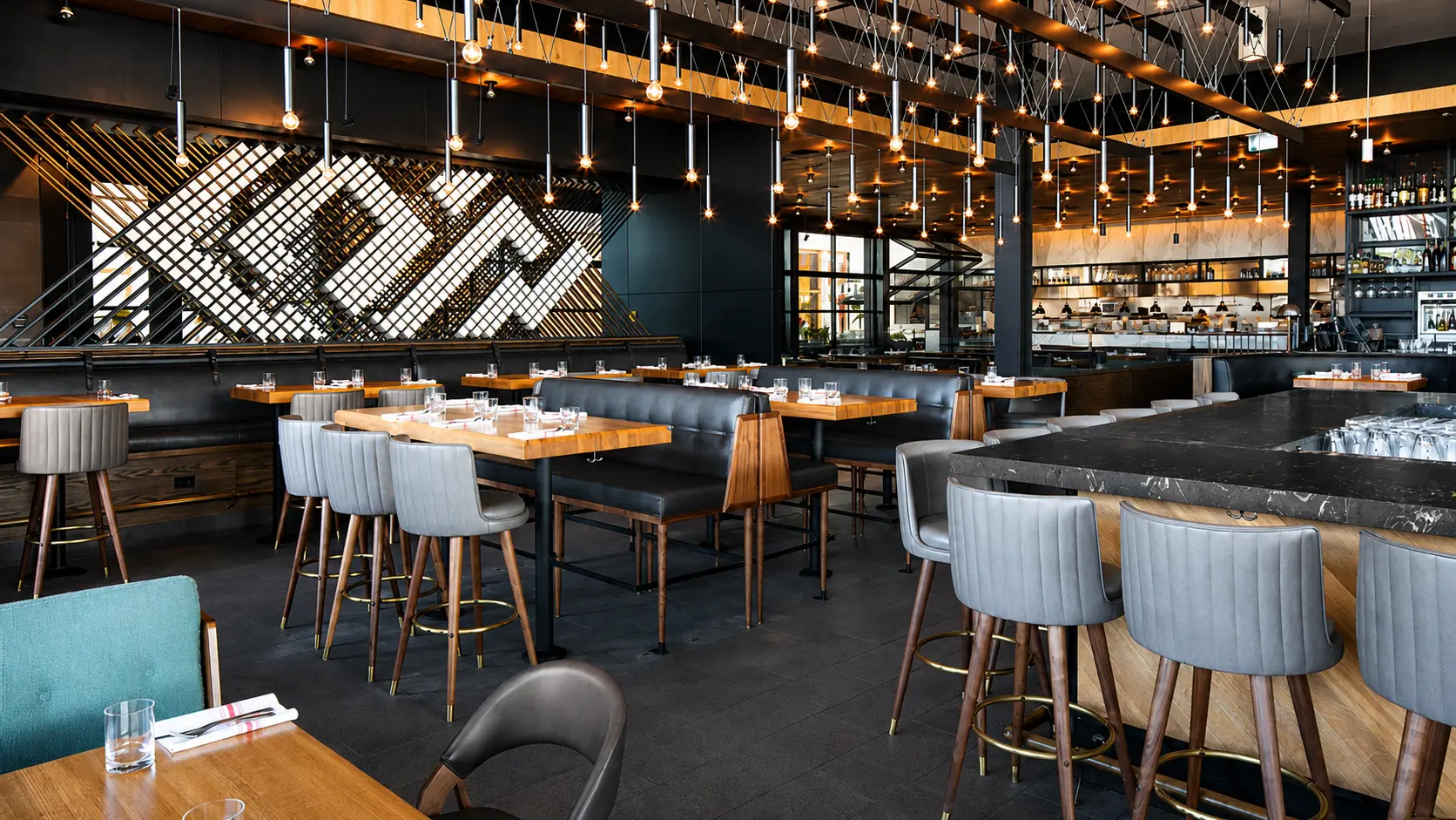 Large exposed bulb chandelier for Earls Kitchen and Bar in Dadeland, Miami, FL, USA. Manufactured by Karice.