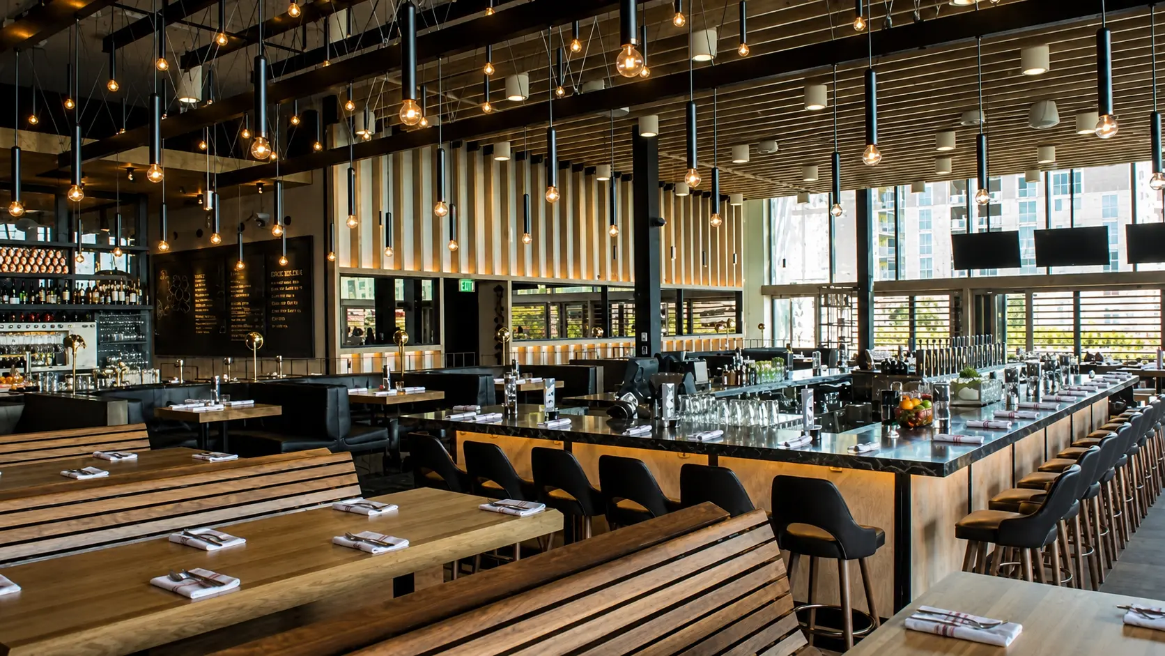 Large exposed bulb chandelier for Earls Kitchen and Bar in Dadeland, Miami, FL, USA. Manufactured by Karice.