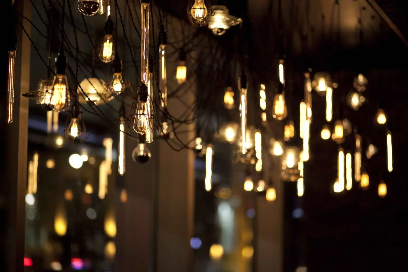 Modern swag chandelier for Earls Kitchen and Bar in King Street, Toronto, ON, CA. Manufactured by Karice.