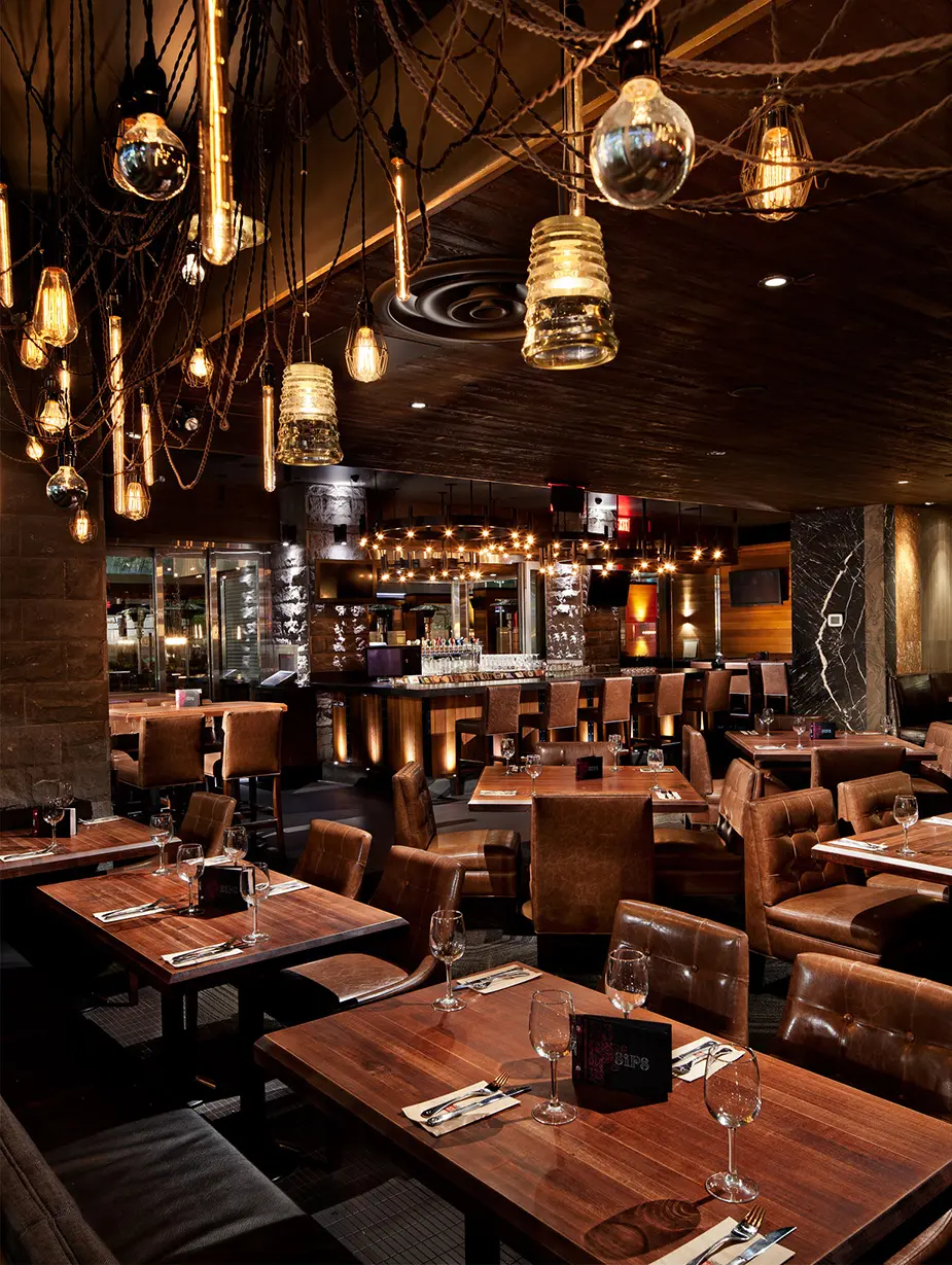 Modern swag chandelier for Earls Kitchen and Bar in King Street, Toronto, ON, CA. Manufactured by Karice.