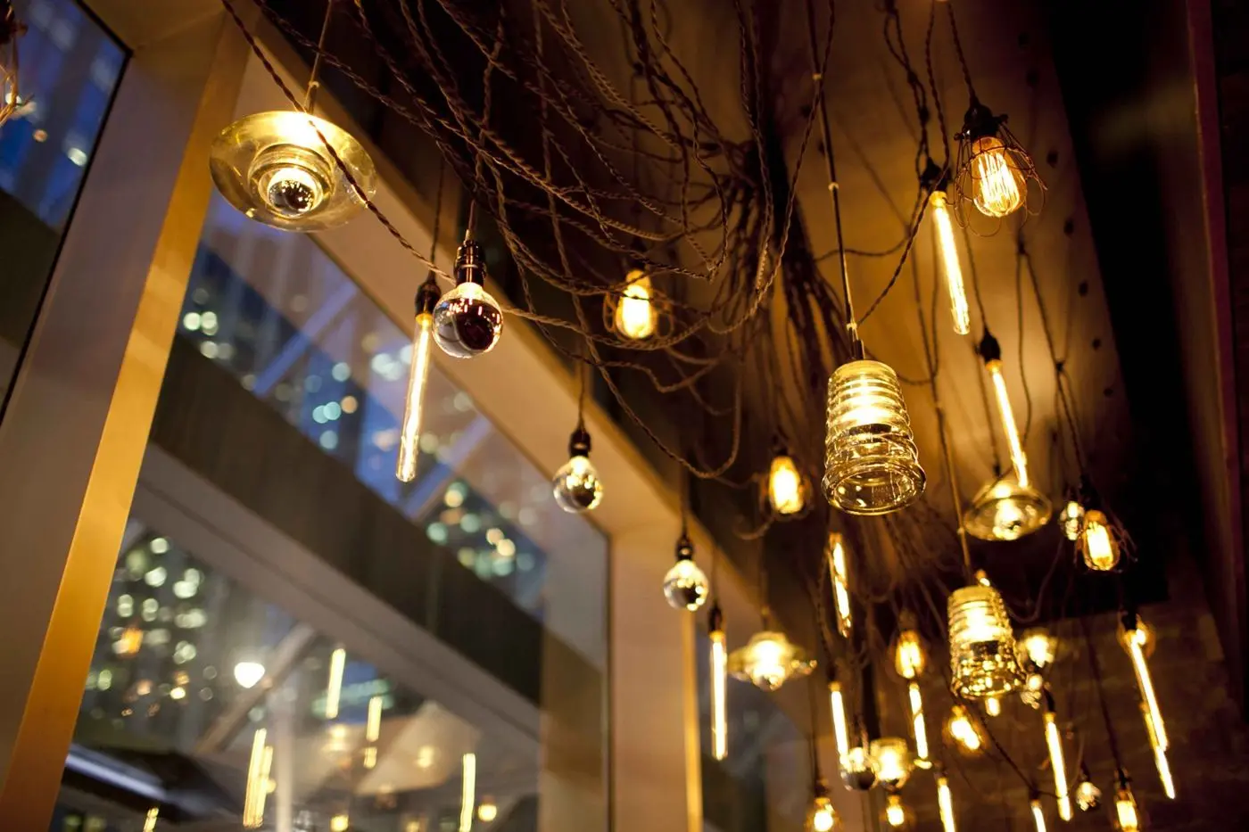 Modern swag chandelier for Earls Kitchen and Bar in King Street, Toronto, ON, CA. Manufactured by Karice.