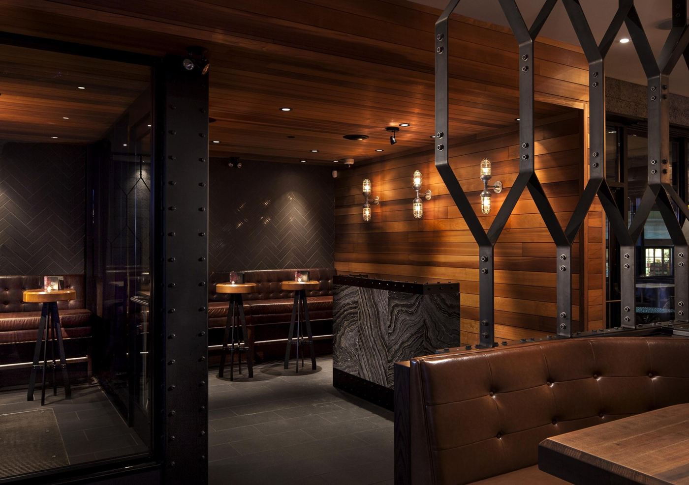 Custom industrial cage wall sconces for Earls Kitchen & Bar in Wellington, London, ON, CA. Manufactured by Karice.