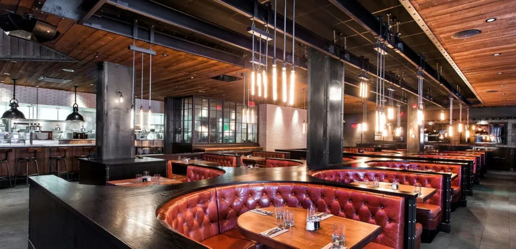 Industrial crane-inspired industrial chandelier for Earls Kitchen and Bar in Jasper Avenue, Edmonton, AB, CA. Manufactured by Karice.