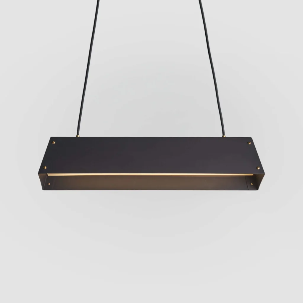 Expanse LED linear light with modular design, acrylic diffuser, braided cord suspension, and integrated LED driver. Designed and manufactured by Karice.