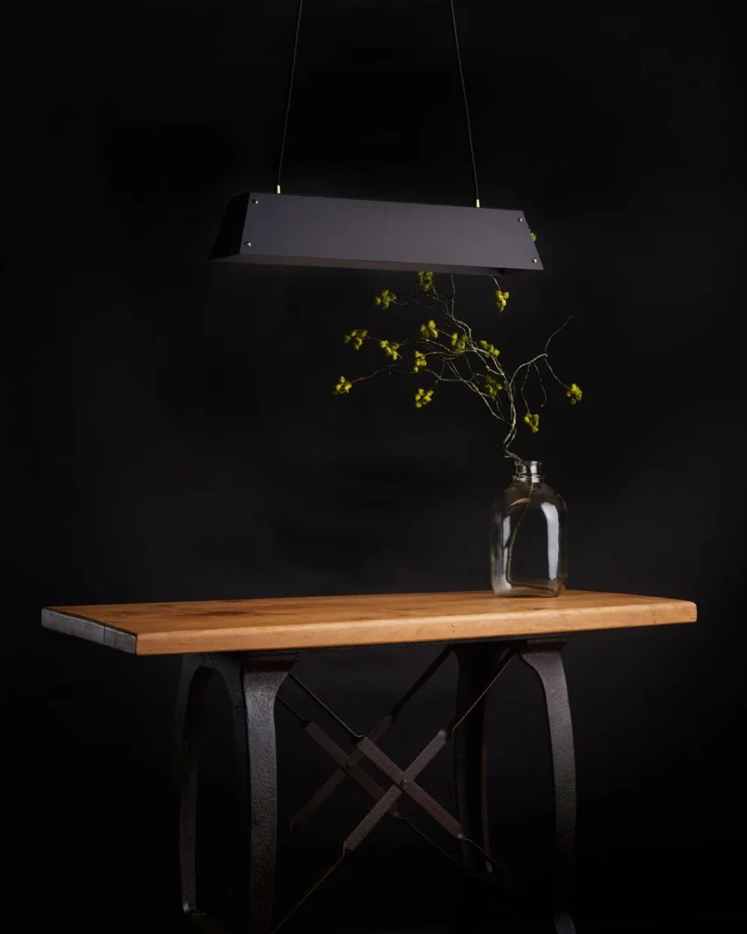 Expanse LED linear light with modular design, acrylic diffuser, braided cord suspension, and integrated LED driver. Designed and manufactured by Karice.