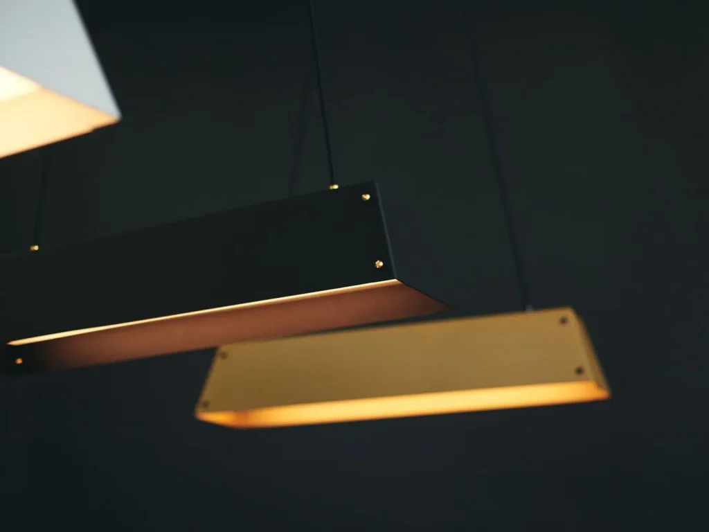 Expanse LED linear light with modular design, acrylic diffuser, braided cord suspension, and integrated LED driver. Designed and manufactured by Karice.