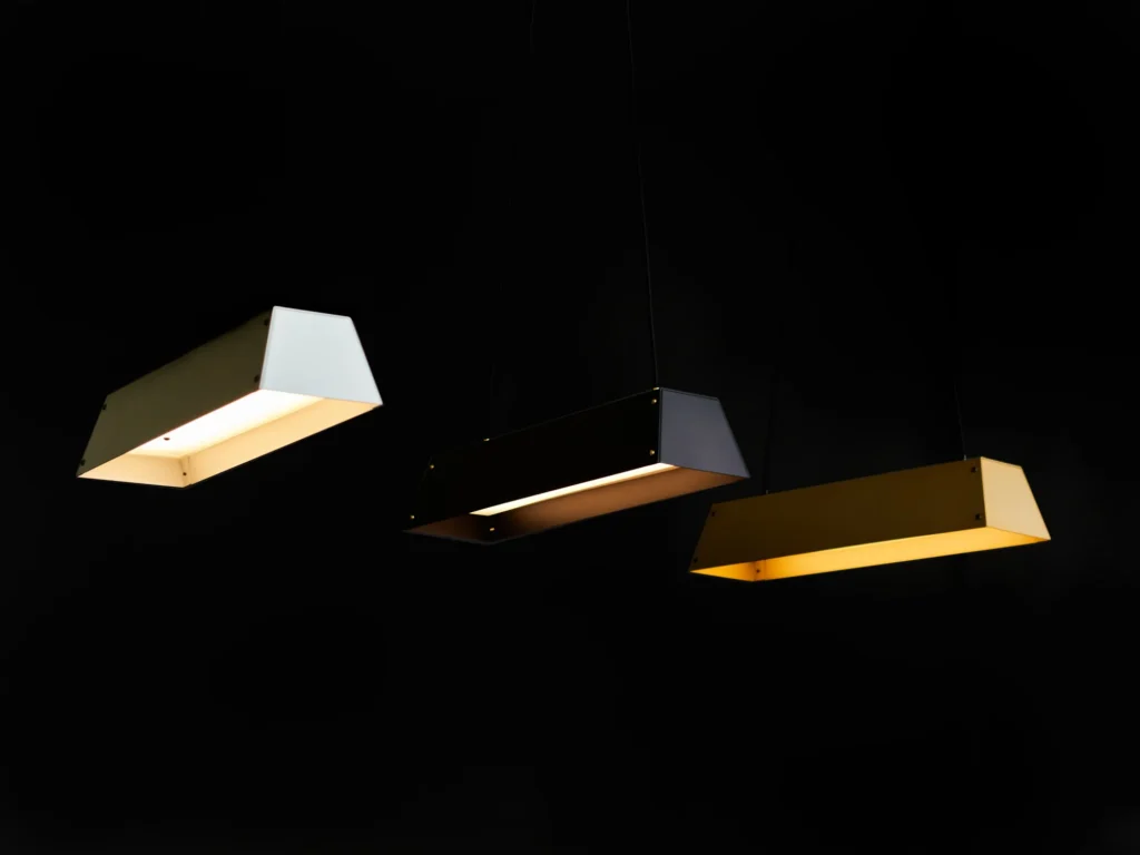 Expanse LED linear light with modular design, acrylic diffuser, braided cord suspension, and integrated LED driver. Designed and manufactured by Karice.