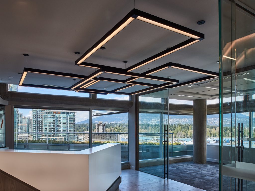 Custom rectangular LED pendant lighting for a Vancouver Corporate Office. Designed and manufactured by Karice.