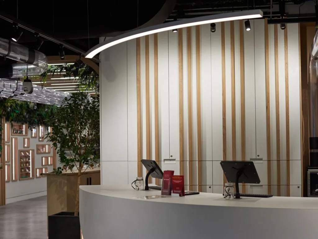 Custom linear LED pendant light for City Cannabis. Manufactured by Karice.
