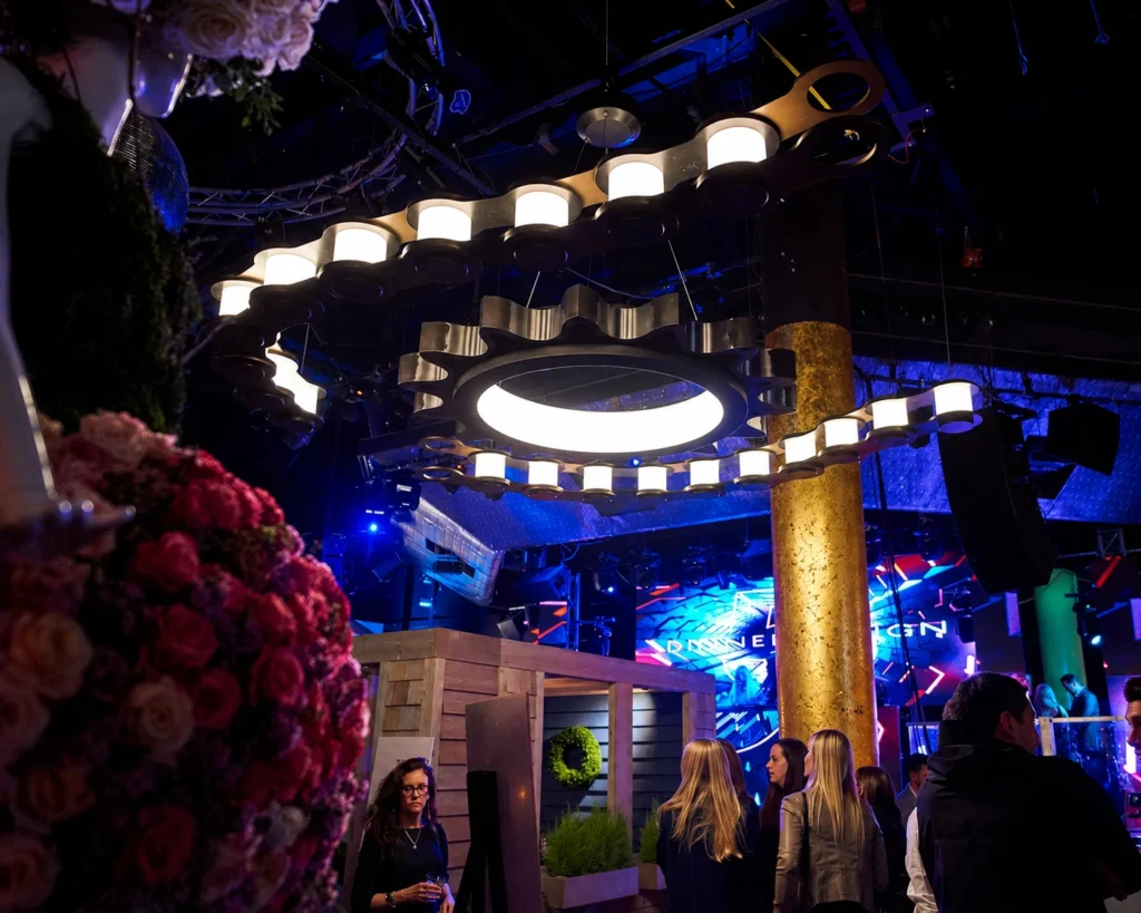Custom LED gear and chain chandelier with steel sprocket for DXD Events in the USA. Manufactured and designed by Karice.