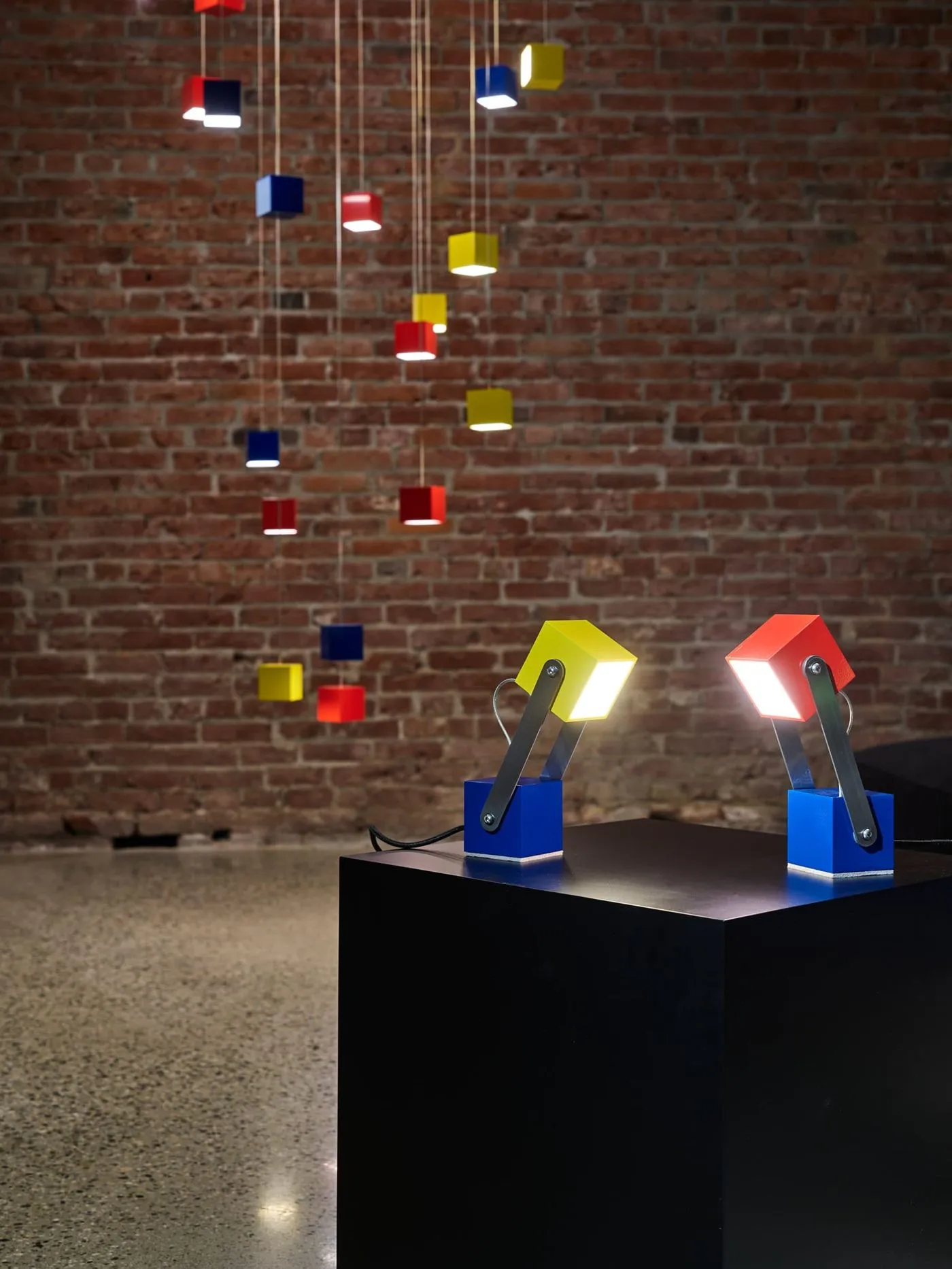 Colorful LED cube pendants and table lamps for Montauk Sofa in Vancouver, BC, CA. Manufactured and designed by Karice.