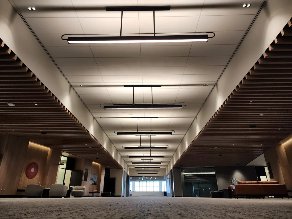Custom linear pendant ceiling lighting for BMO Convention Centre in Calgary, AB, Canada. Manufactured by Karice.