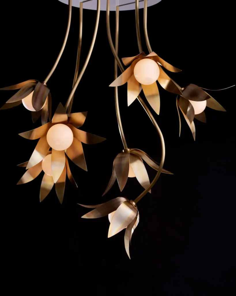 Bloom LED pendant with hand-blown glass and hand-formed brass petals, designed as a floral-inspired light fixture with dim-to-warm LED illumination. Designed and manufactured by Karice.