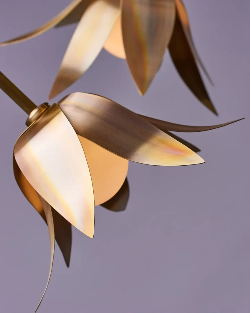 Bloom LED pendant with hand-blown glass and hand-formed brass petals, designed as a floral-inspired light fixture with dim-to-warm LED illumination. Designed and manufactured by Karice.