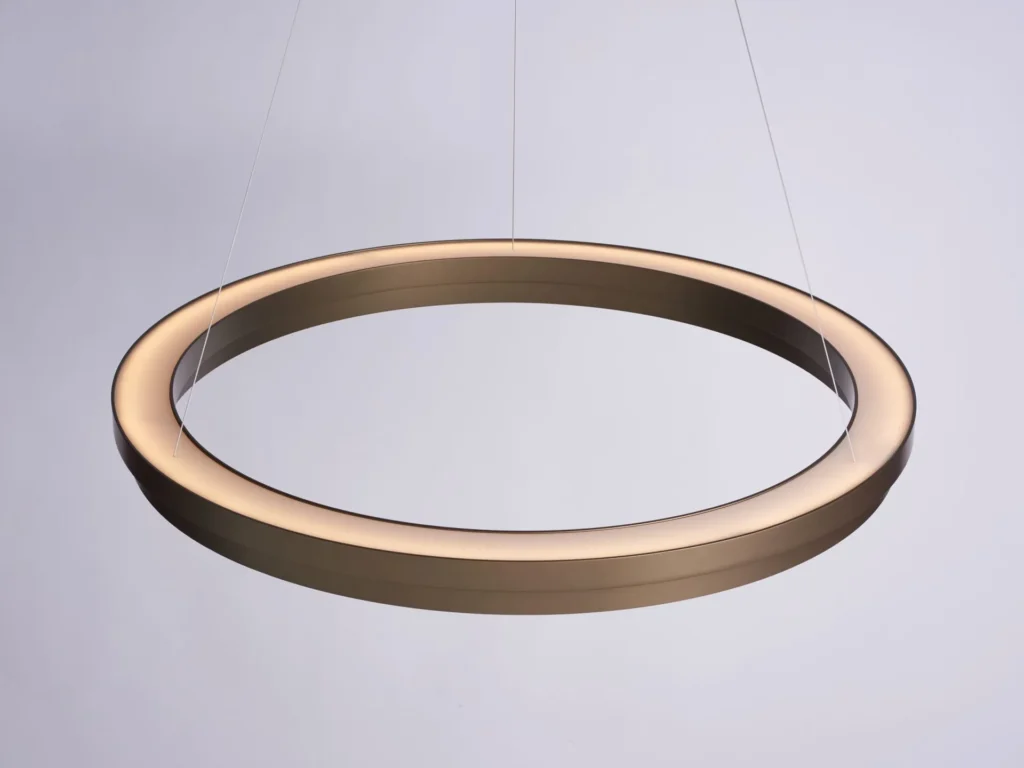 Circulus LED pendant light with circular aluminum form, 360-degree illumination, and stepped ring design in a medium bronze finish. Designed and manufactured by Karice.