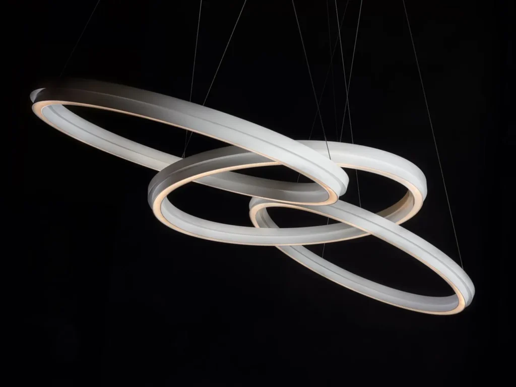 Circulus LED pendant light with circular aluminum form, 360-degree illumination, and stepped ring design in a medium bronze finish. Designed and manufactured by Karice.