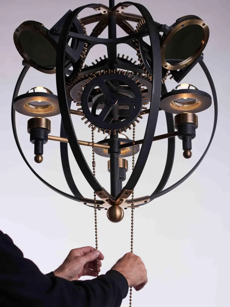Da Vinci Leonardo 1482 sculptural light with brass gears, magnifiers, mirrors, and adjustable directional illumination. Designed and manufactured by Karice.