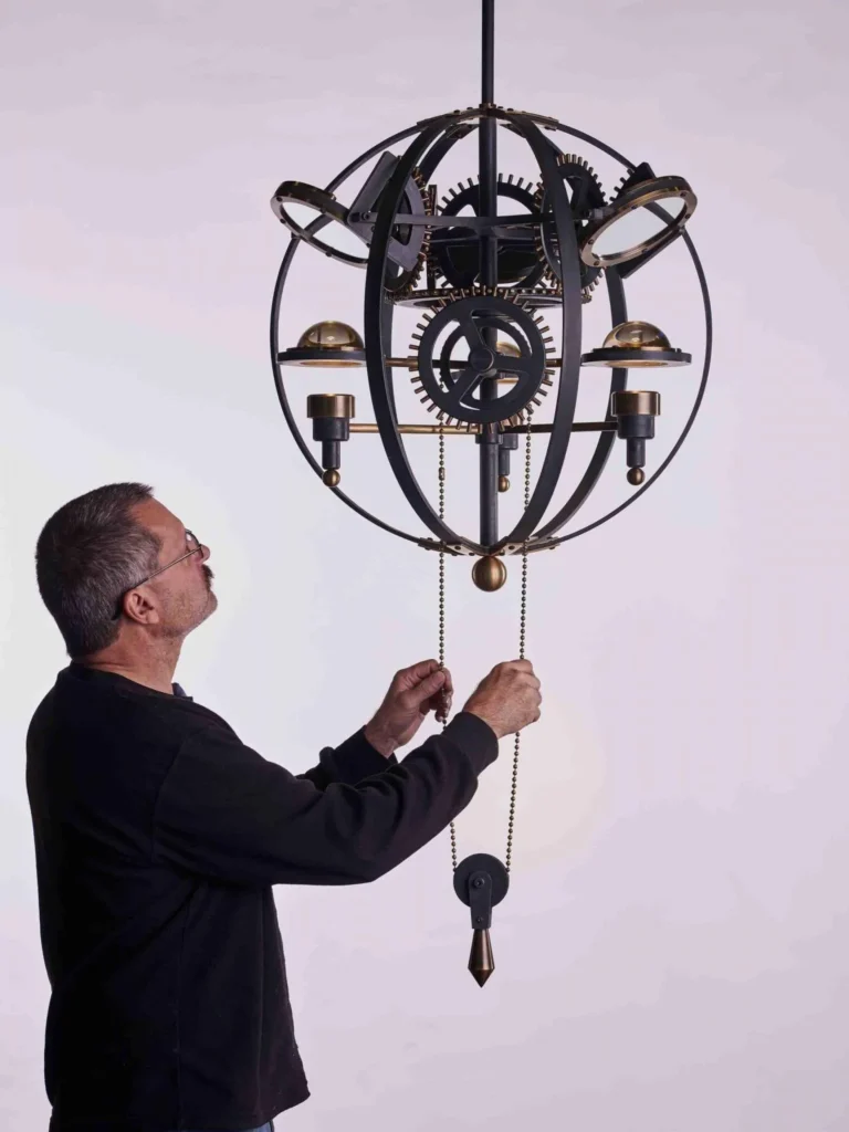 Da Vinci Leonardo 1482 sculptural light with brass gears, magnifiers, mirrors, and adjustable directional illumination. Designed and manufactured by Karice.