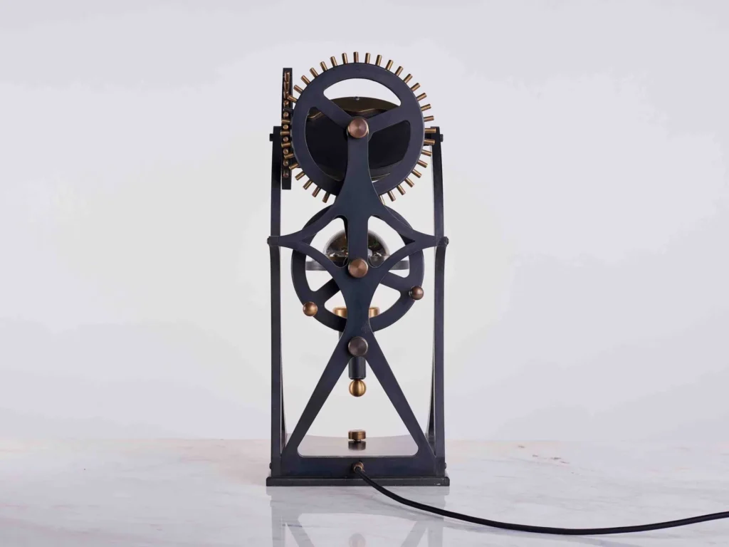 Da Vinci Vitruvian table lamp with geometric form, patinated metal, and antiqued brass details. Designed and manufactured by Karice.