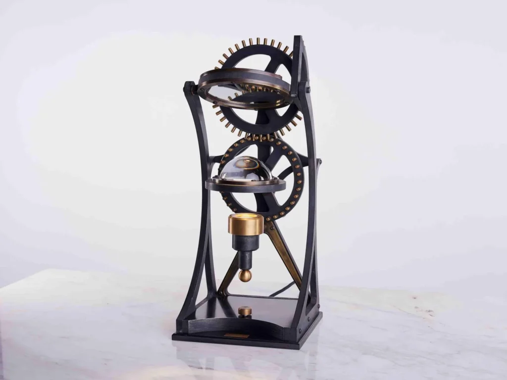 Da Vinci Vitruvian table lamp with geometric form, patinated metal, and antiqued brass details. Designed and manufactured by Karice.