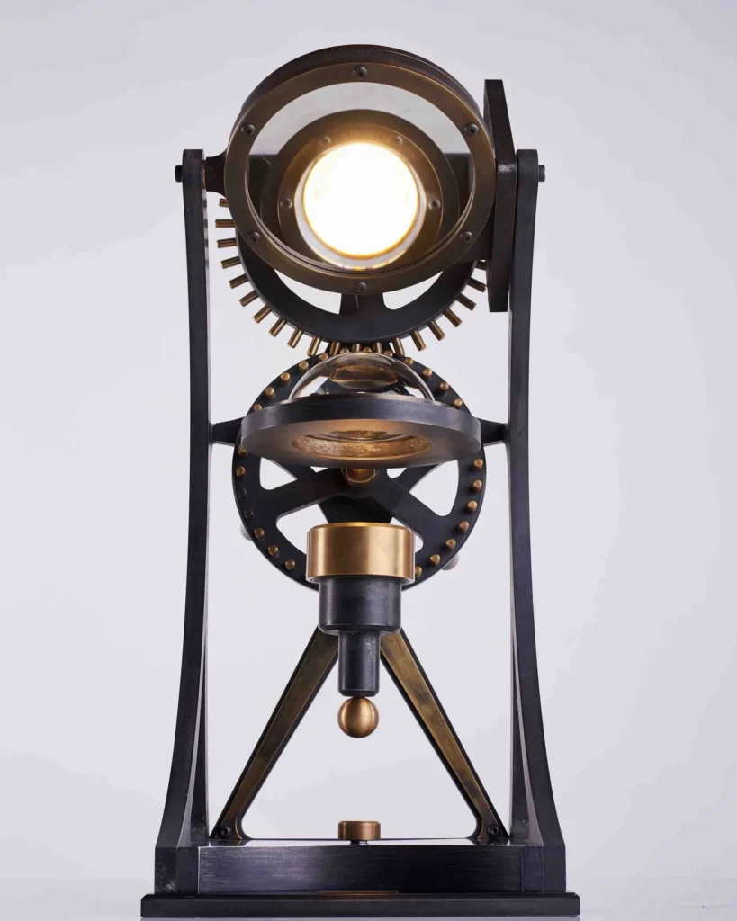 Da Vinci Vitruvian table lamp with geometric form, patinated metal, and antiqued brass details. Designed and manufactured by Karice.