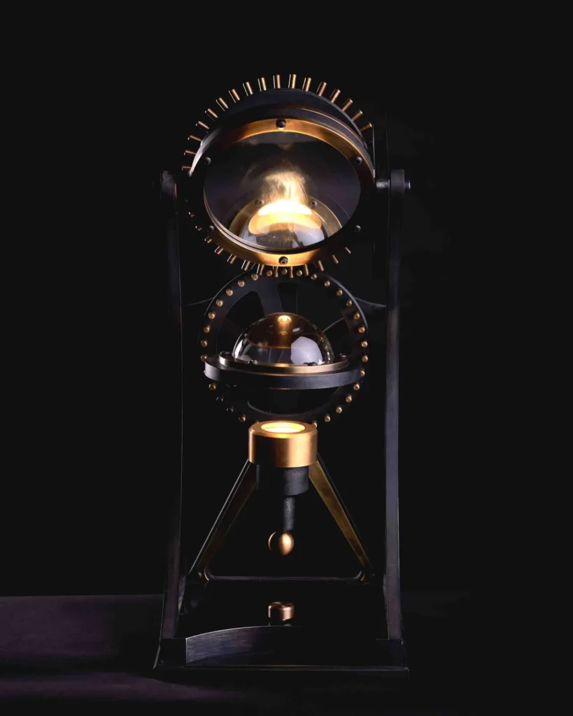 Da Vinci Vitruvian table lamp with geometric form, patinated metal, and antiqued brass details. Designed and manufactured by Karice.