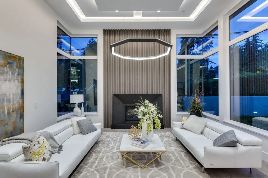 Luxennea Diamond Series 2 LED chandelier with faceted enneagon design and ambient downlighting. Designed and manufactured by Karice.