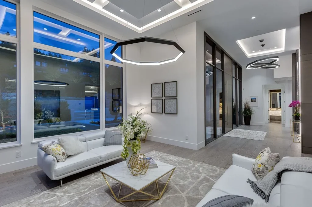 Luxennea Diamond Series 2 LED chandelier with faceted enneagon design and ambient downlighting. Designed and manufactured by Karice.