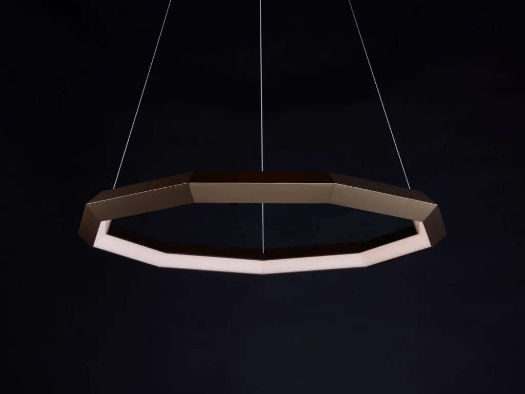Luxennea Diamond Series 2 LED chandelier with faceted enneagon design and ambient downlighting. Designed and manufactured by Karice.