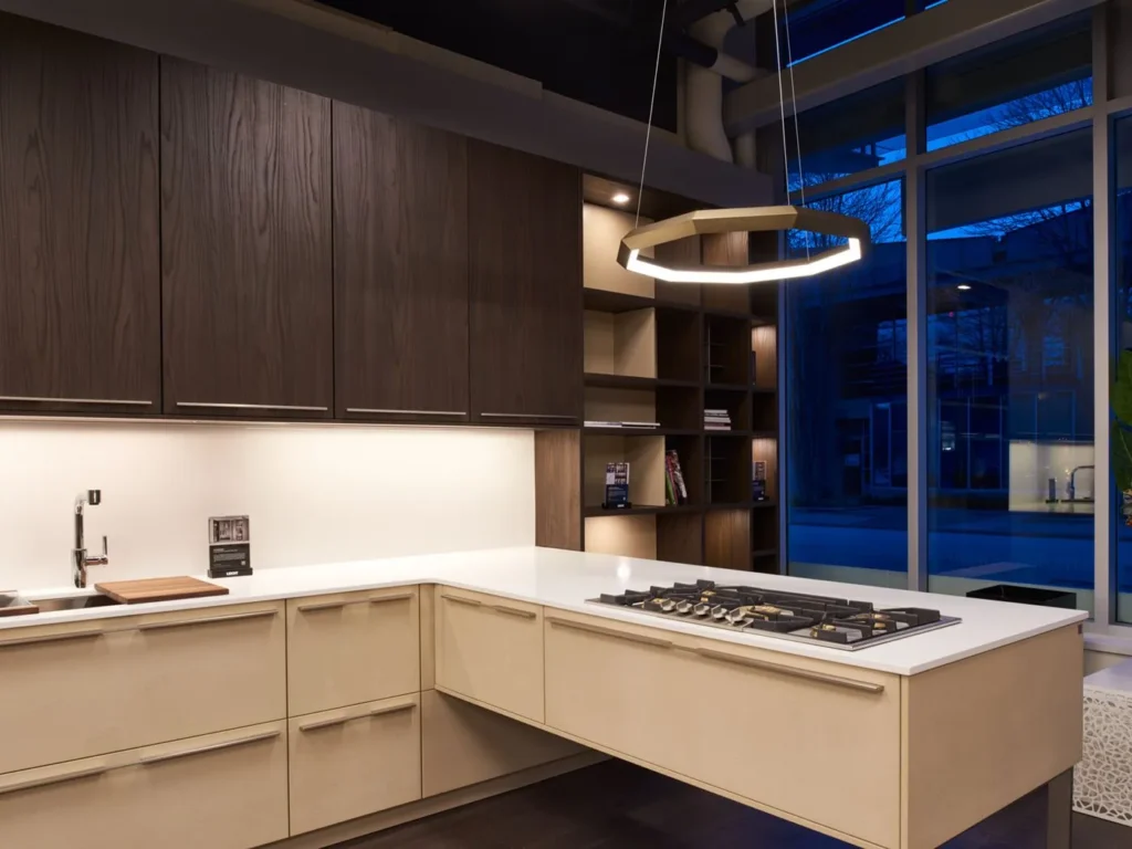 Luxennea Diamond Series 2 LED chandelier with faceted enneagon design and ambient downlighting. Designed and manufactured by Karice.