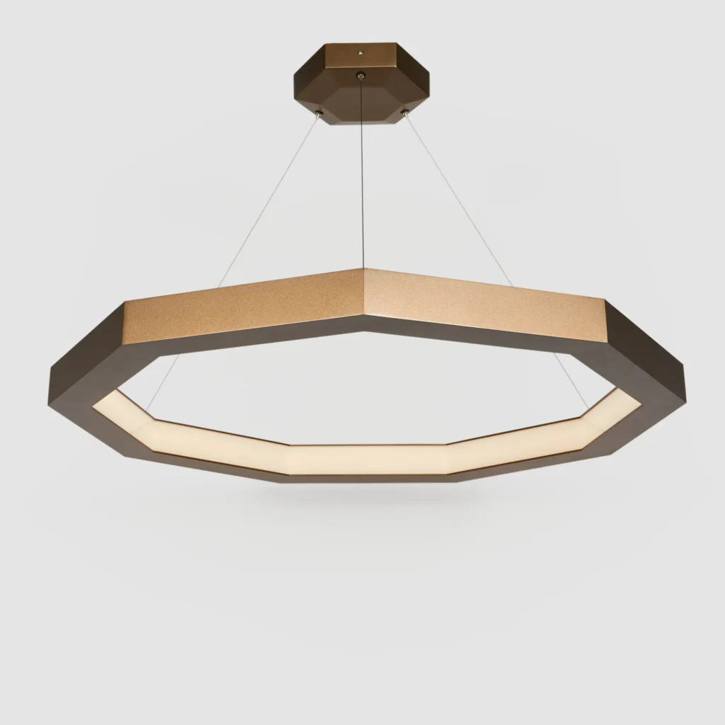 Luxennea enneagon LED pendant with aluminum frame, acrylic diffuser, and custom bronze finish. Designed and manufactured by Karice.