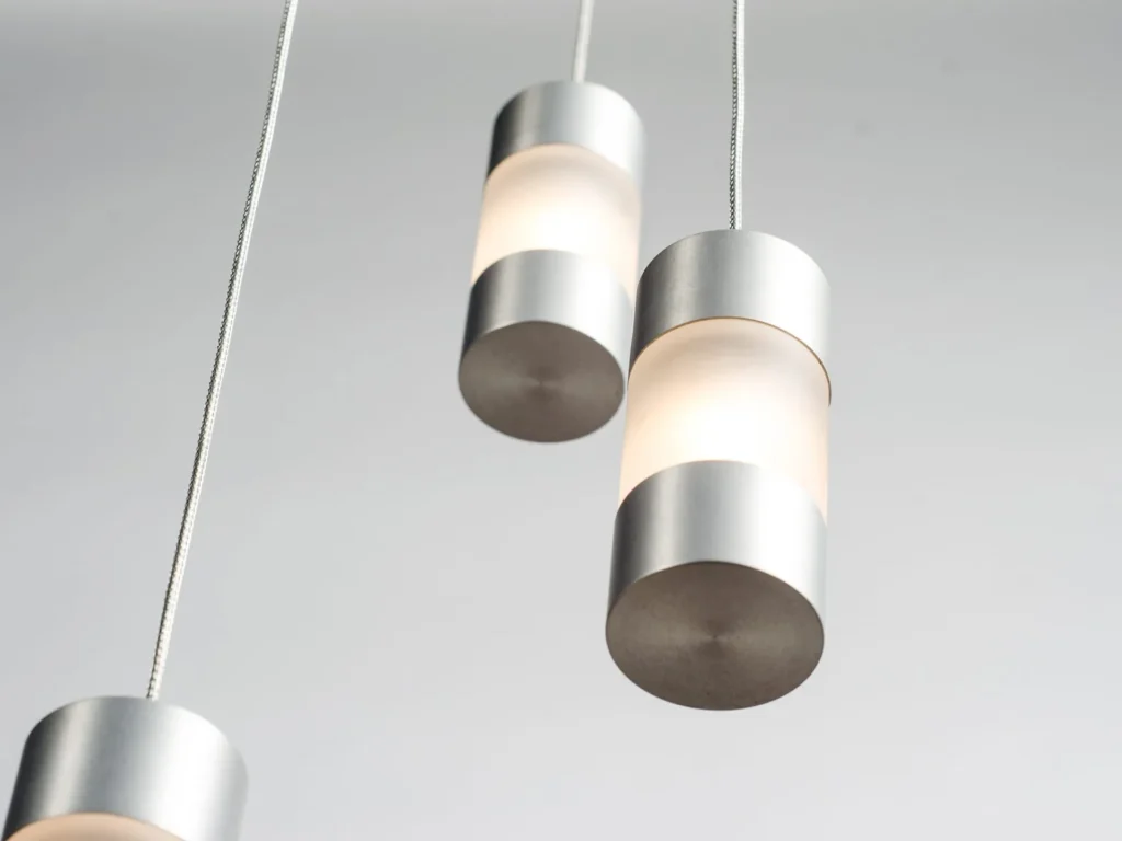 Mini Fuse LED pendant with flattened ends, acrylic diffuser, and minimalist automotive fuse-inspired design. Designed and manufactured by Karice.