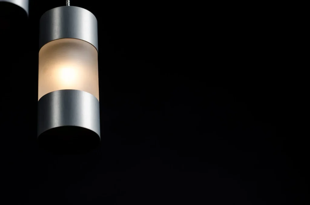 Mini Fuse LED pendant with flattened ends, acrylic diffuser, and minimalist automotive fuse-inspired design. Designed and manufactured by Karice.