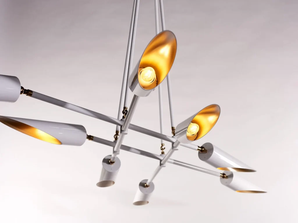 Octave mid-century chandelier with eight adjustable tilting shades, genuine brass swivels, and black or white finish options. Designed and manufactured by Karice.