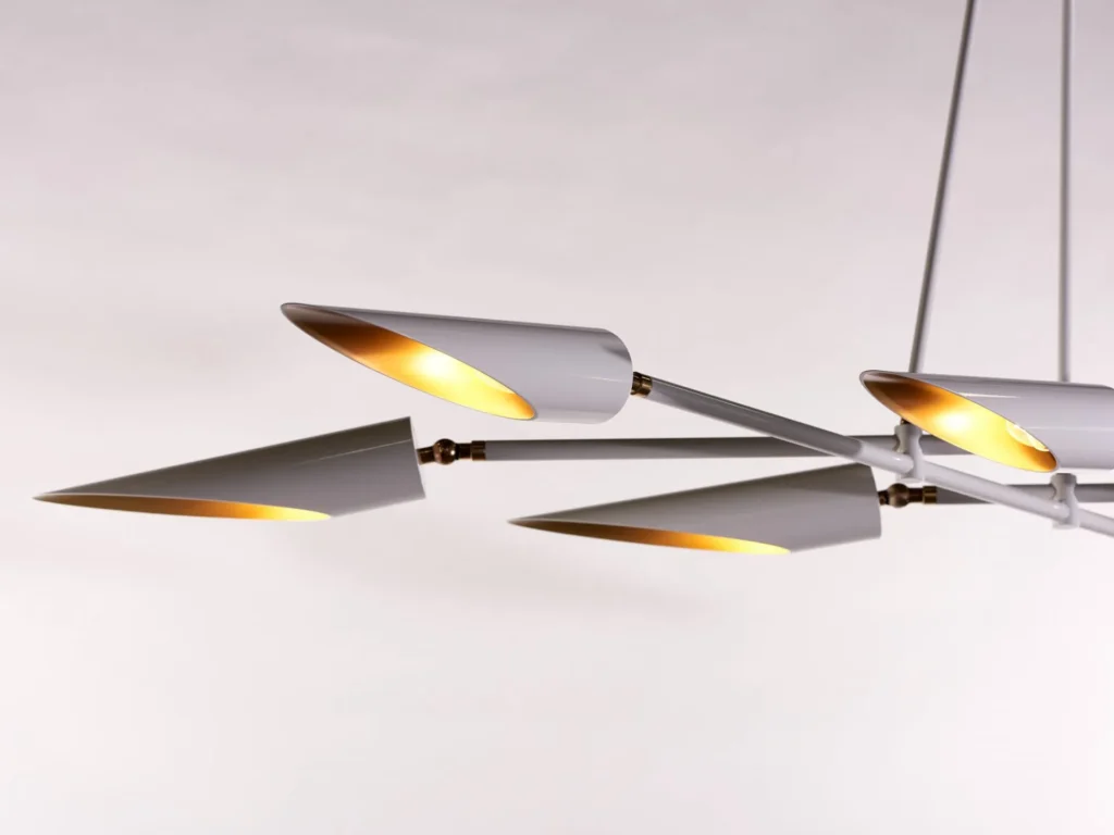 Octave mid-century chandelier with eight adjustable tilting shades, genuine brass swivels, and black or white finish options. Designed and manufactured by Karice.
